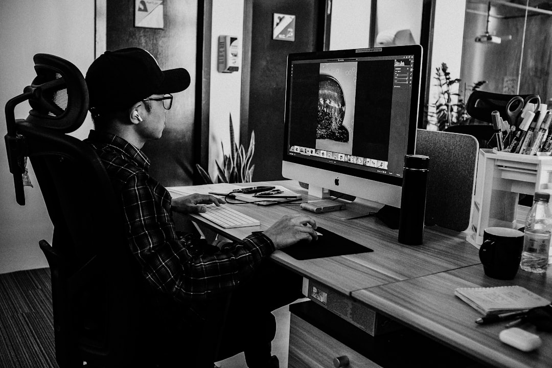 Youtube Seo Video Creator At Desk With Analytics Screen And Search Bar